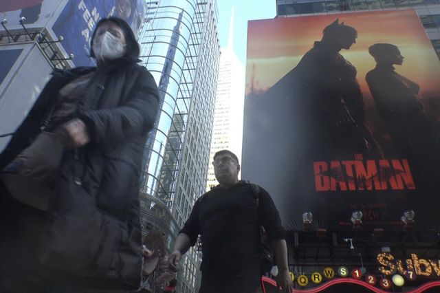 people walking through Times Square